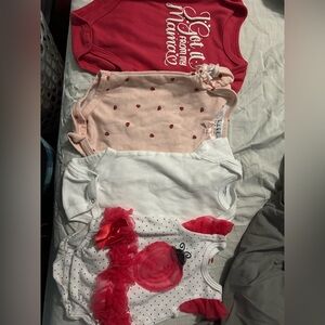 Set of Three Baby Bodysuits in Pink, White, and Red